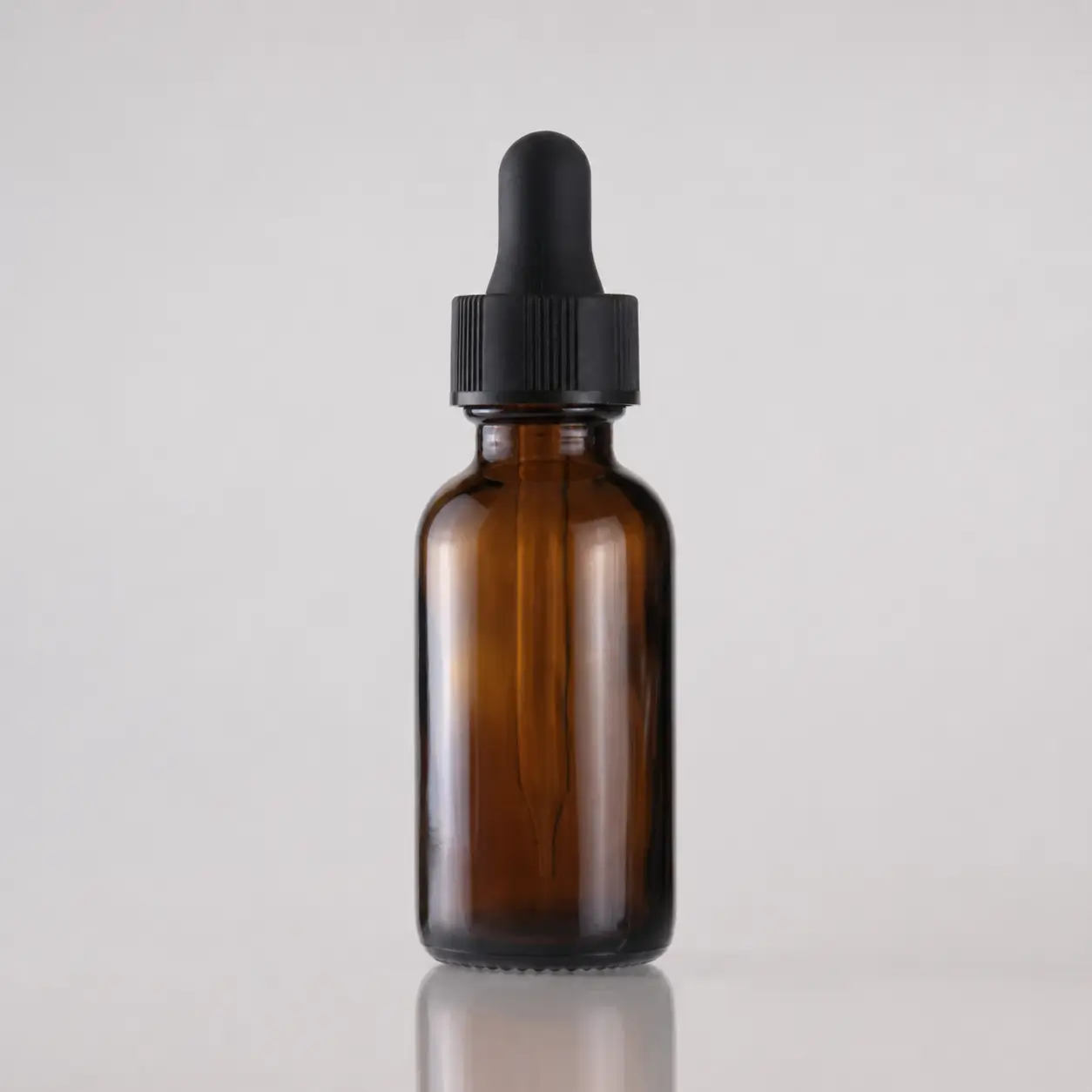 30ml amber Boston round glass bottle with black dropper